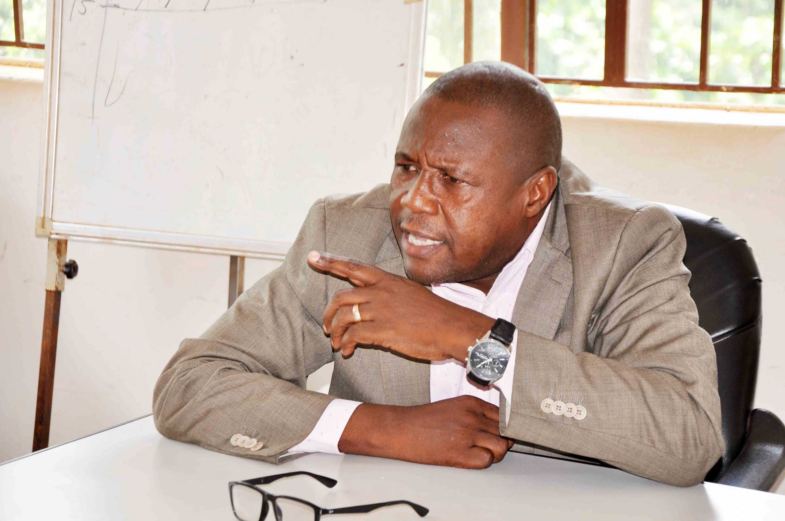 Wakiso district LC5 chair man Matia Lwanga Bwanika addressing the media at the district head quaters on Saturday. Photo by Job Nantakiika